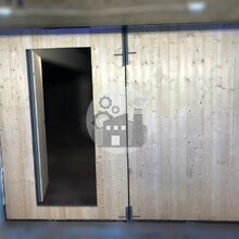 гаражные ворота с отделкой деревянным штакетником внутри